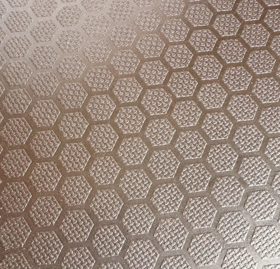 Close view of a brown anti-slip plywood face embossed with a hexagon pattern